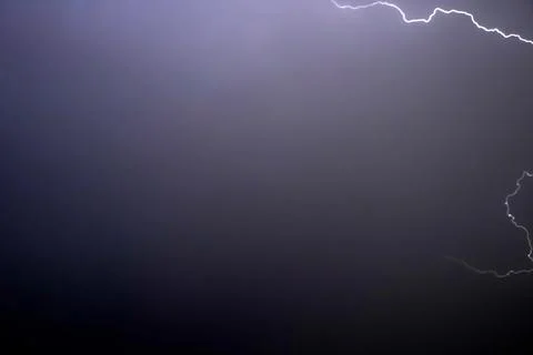 Thundering light in sky at night in rainy season Stock Photos