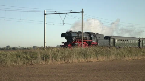 Thundering Through Time: Historical Steam Engine in Full Speed Stock Footage 240984305