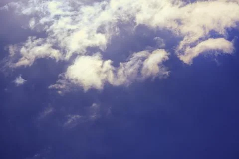 Thunderous black cloud on a dark sky background with sun rays Stock Photos