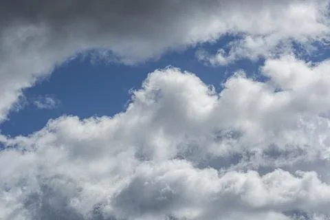 Thunderous gray clouds on the blue sky texture background Stock Photos