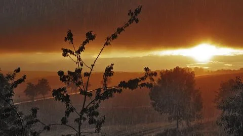 Thundershowers at sunset Stock Photos