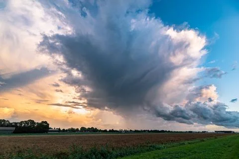 Thunderstorm anvil at sunset Stock Photos