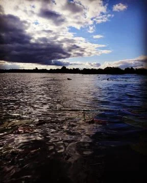 A thunderstorm is approaching the lake Stock Photos