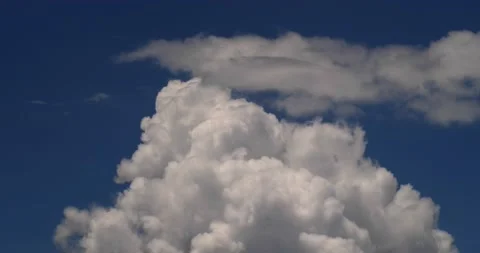 Thunderstorm builds with blue sky in background Stock Footage 152525462