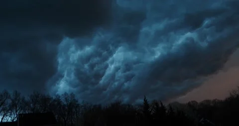 Thunderstorm clouds dark and black in the sky above a forest Video stock 205448069