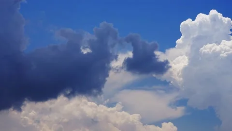 Thunderstorm clouds forming time lapse in summer blue sky Video stock 168973639