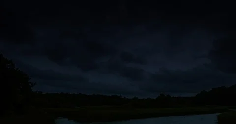 Thunderstorm clouds at night with lightning. 4K Timelapse Loop. Stock Footage 125410643
