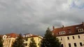 Thunderstorm clouds over sunny main street city buildings panning 4k or 4k+ Resolution