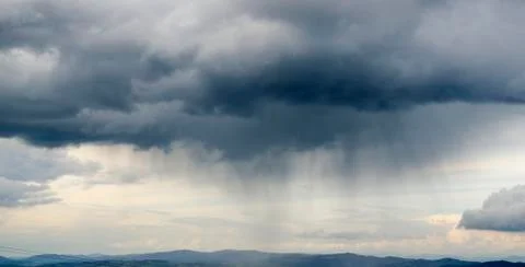 Thunderstorm coming and clouds raining Stock Photos