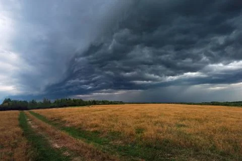 Thunderstorm is coming. Large clouds and clouds thickened on a summer day Stock Photos