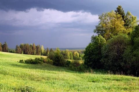 Thunderstorm is coming. Large clouds and clouds thickened on a summer day Stock Photos
