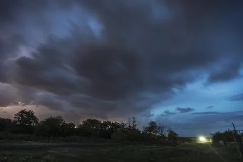 A thunderstorm is coming at night Stock Photos