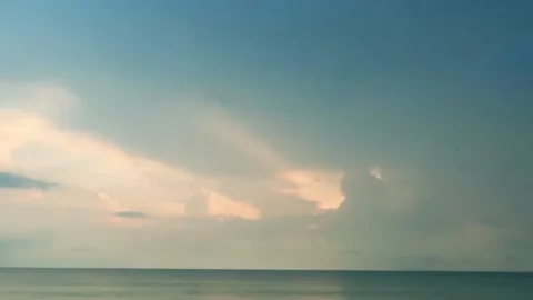 Thunderstorm dark cloud on cyan blue sky over sea water n ocean wave horizon Stock Footage 195287496