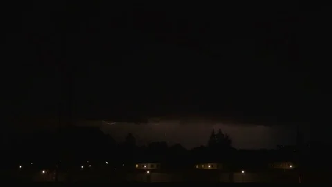 Thunderstorm flashes and lightning over the city, time lapse Stock Footage 77449594