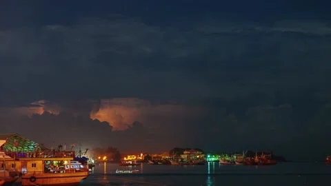 Thunderstorm, lightning and city pier with boats Stock Footage 175332396