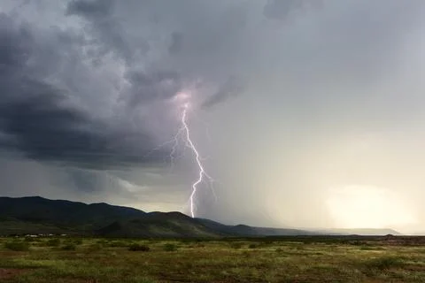 Thunderstorm with lightning bolt and rain Stock Photos