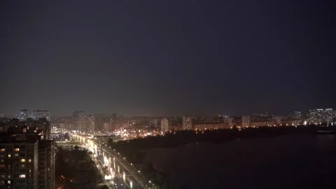 Thunderstorm with lightning over the night city, over residential. Slow motion Stock Footage 202347599