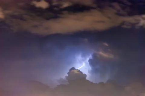 Thunderstorm lightning. Storm is coming with dramatic sky and heavy clouds. Stock Photos