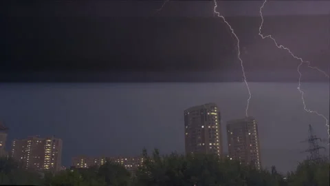 Thunderstorm Lightning strikes high rise apartment building. Dark night sky Video stock 297641417