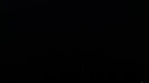Thunderstorm in the night sky. Flashes of lightning in the black sky. Nature Stock Footage 254006941