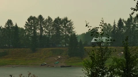 Thunderstorm over forest village Stock Footage 73325906