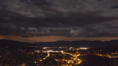 Thunderstorm over mountain town of Estes Park Colorado with city lights Stock Footage 135266495