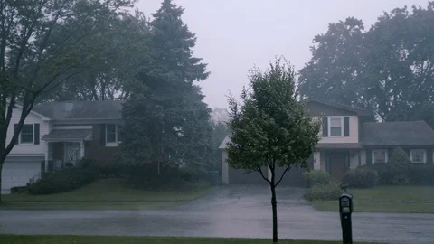 Thunderstorm in the village, heavy rain, trees in the wind. Hurricane, severe Video stock 123797295