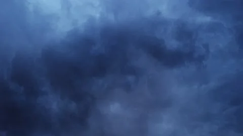 Thunderstorms and dark thick clouds moving in the sky before it rains. Stock Footage 163826931