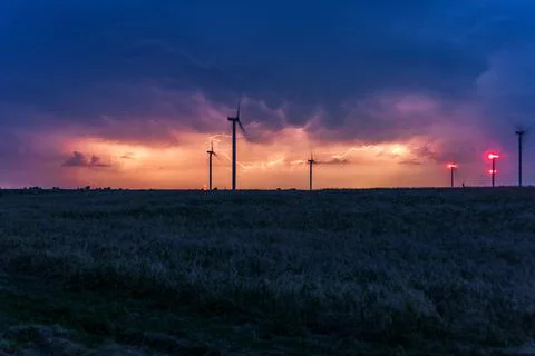 Thunderstorms over windmill. Lightning storms Stock Photos