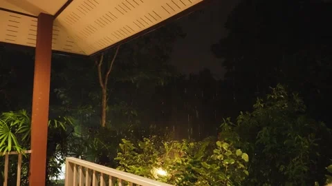 Thunderstrike in the night raining on porch Stock Footage 291114255