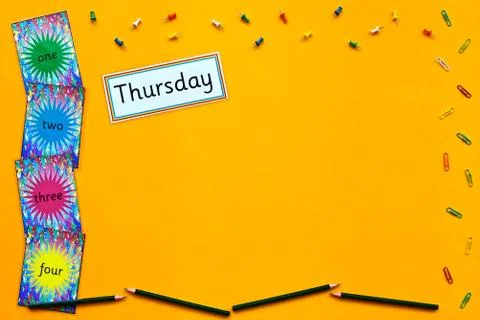 Thursday learning flatlay on yellow background. Stock Photos