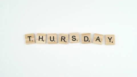 Thursday Written In Scrabble Blocks. 4k Shot Of Hand Placing Wooden Game Stock Footage 156364537
