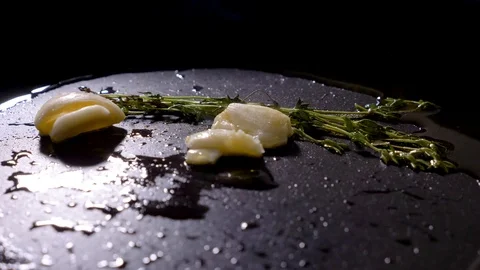 Thyme and garlic grill on a pan with olive oil Stock Footage 94263777