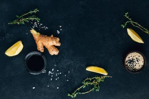 Thyme, ginger, lemon, soy sauce and sesame. Ingredients for cooking fish Stock Photos
