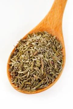Thyme in wooden spoon Stock Photos