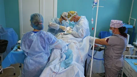 Thyroid surgery performed by a couple of surgeons in modern clinics.  Video stock 226954738