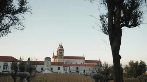 Tibaes monastery framed by trees at dusk 動画素材 346182856