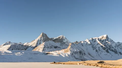 Tibet Snow Mountain Sunlight and Shadow Time-lapse Stock Footage 326664374