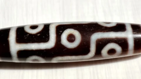 Tibetan amulet agate DZI bead, 9 eyes, close up Видео 200948716