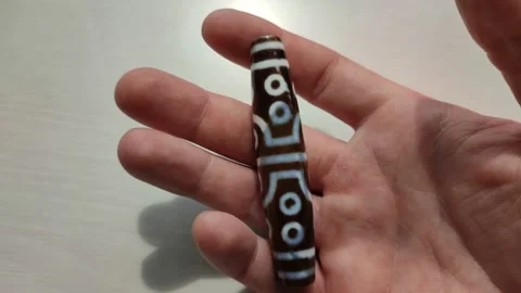 Tibetan amulet agate DZI bead, eyes, close up 動画素材 200948870