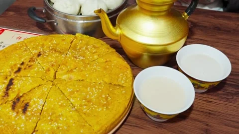 Tibetan Breakfast Featuring Butter Tea, Barley Flatbread, and Steamed Buns 動画素材 312583953