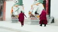 Tibetan Buddhist monks approach the Labrang Tibetan Buddhist Monastery HD Footage