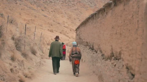 Tibetan Buddhist pilgrims circumambulate Labrang Monastery, Xiahe, China Stock Footage 55768719