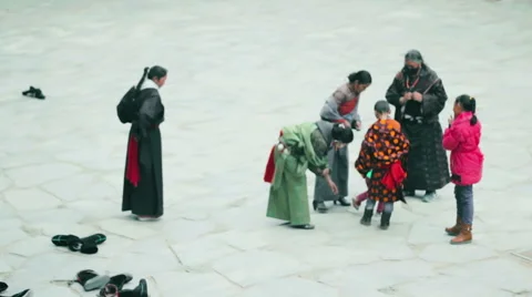 Tibetan Buddhist pilgrims gather at Labrang Monastery, China Stock Footage 57216502