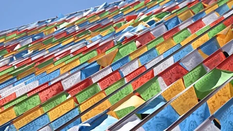 Tibetan buddhist prayer flags blowing in the wind Stock Footage 118918542