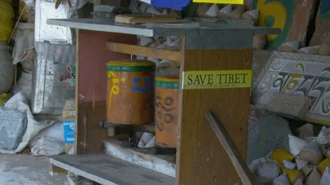 Tibetan Buddhist prayer wheels - Save Tibet sticker Stock Footage 126995597