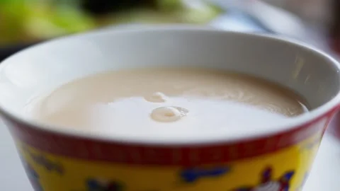 Tibetan Butter Tea in Yellow Patterned Bowl — Overhead Still View Stock Footage 312583722