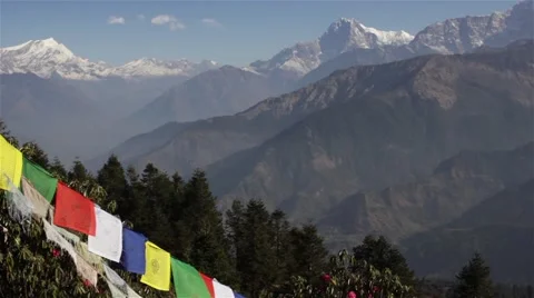 Tibetan flags flutter in wind near beautiful mountain ranges Stock Footage 67646066