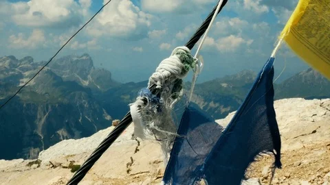 Tibetan flags waving on a mountain top in South Tyrol Video stock 95315872