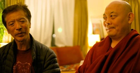 Tibetan Monk Interview segments on healing, kindness &amp; Buddhism Stock Footage 109375547
